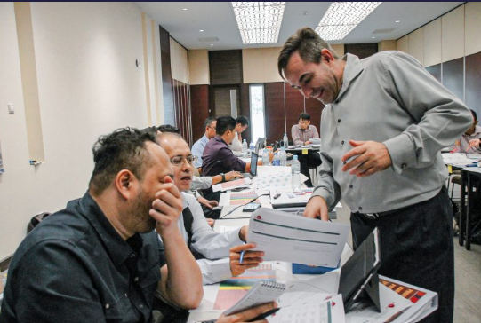Delegates working through a course exercise
