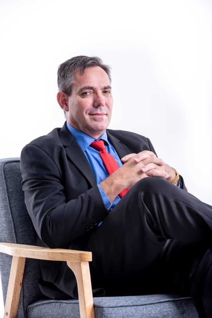 Studio portrait of Kevin in't Veld in a suit